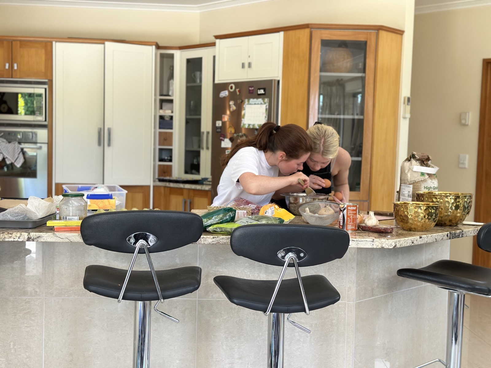 Lisa cooking with a friend